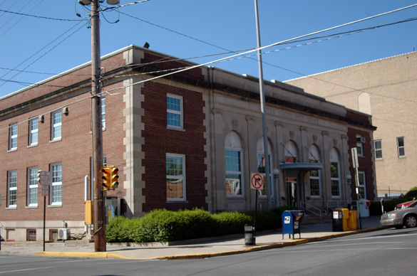 The object’s size hovering over a neighbor’s rooftop was described as the size of an above ground swimming pool. Pictured: Lewistown, PA, Post Office (Credit: Wikimedia Commons)